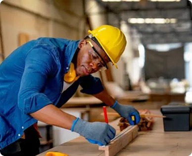 Carpenter measuring wood
